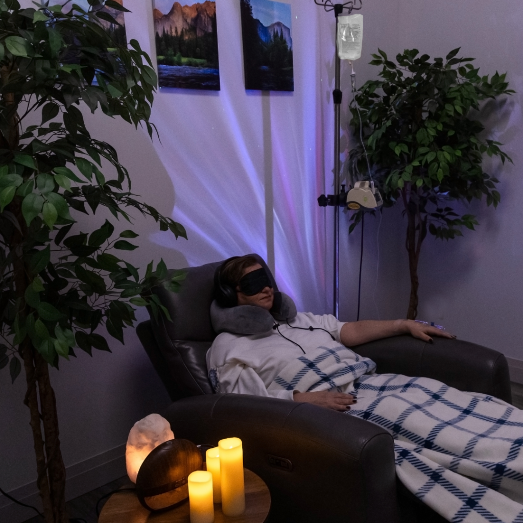Patient relaxing during a medically supervised infusion therapy session in a Toronto clinic